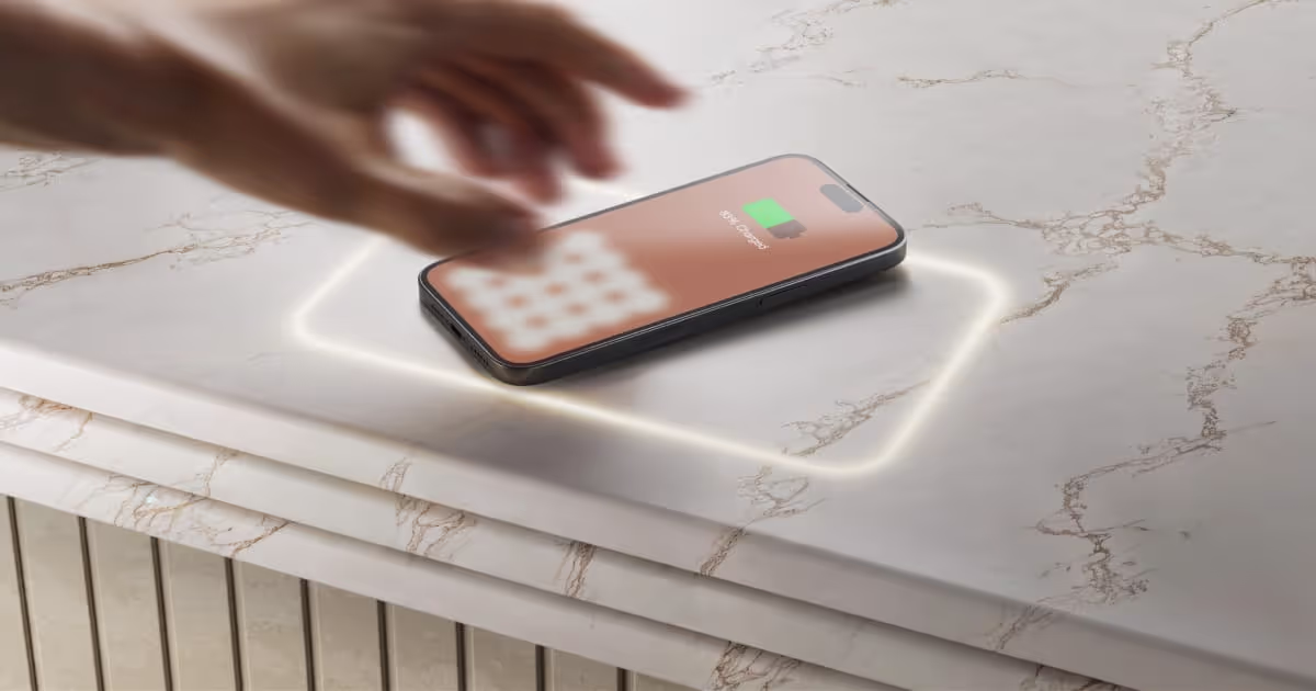 Phone charging on a stone countertop